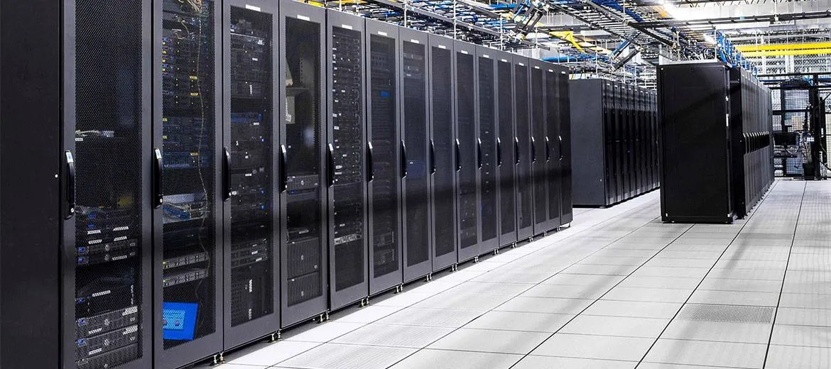 Data center aisle with server racks and blue lighting